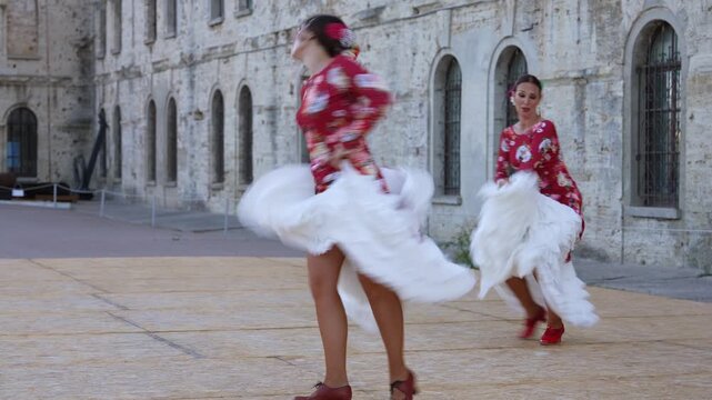 Flamenco Dancers Performing on Spanish Square in Red