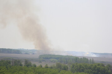 Fototapeta premium Hemp bale fire in the valley.