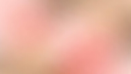 Blurry abstract background with pink and beige colors blending together smoothly