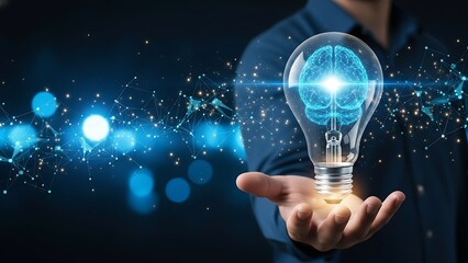 Hand holding glowing brain inside futuristic light bulb