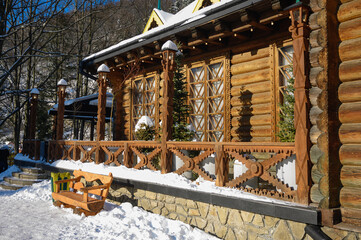 Wooden house porch with rustic steps and railing, traditional rural architecture detail, cozy and charming outdoor entrance.