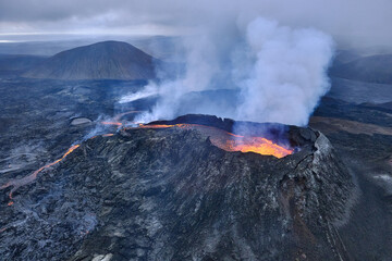 Volcano erupts and emits volcanic ash. Violent volcanic eruption. Mountain. Eruption of Lewotobi Laki-Laki volcano in East Flores, Indonesia © Footage pro plus