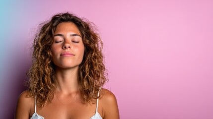 A serene portrait of a woman with closed eyes and gentle smiles against a soft pink background captures the essence of tranquility, inviting viewers to embrace moments of peace and self-reflection.