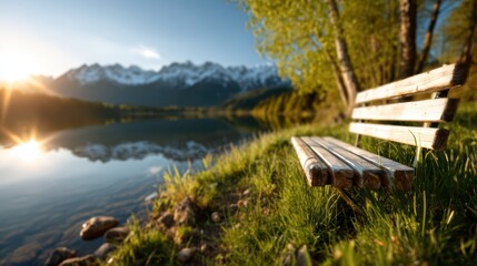 A tranquil bench overlooking a serene lake surrounded by majestic mountains, capturing the peaceful ambiance of nature during the golden hour with beautiful reflections.