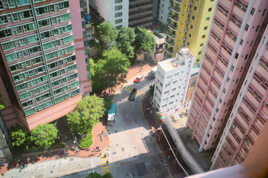 Aerial view of a vibrant cityscape with tall colorful buildings and bustling streets. Hongkong, China