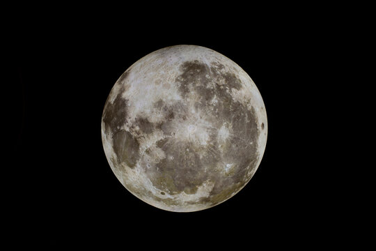 Bright full moon against a dark black sky, showcasing intricate surface details. Shanghai, China