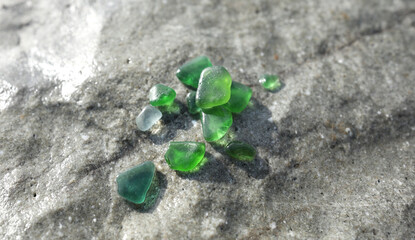 Glass sea pebbles of different colours on shore, beach. Nature and ecology. Background for design.