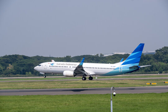 Jakarta, Indonesia &ndash; December 25, 2025: A Garuda Indonesia Airlines aircraft lands on the runway at Soekarno-Hatta International Airport under a cloudy sky.