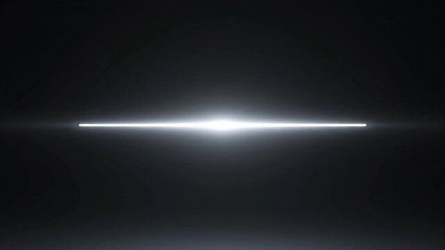 Horizontal light beam slicing through darkness creating a dramatic glow and line of brightness.