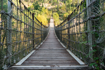 Wooden Suspension Bridge over Valley