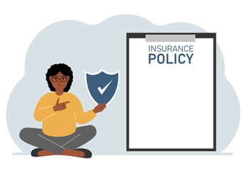 A woman holds an insurance policy sign in his hands. The concept of life insurance, property or natural disasters.