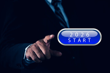 Businessman press blue illuminated start button year 2026, Start up business concept