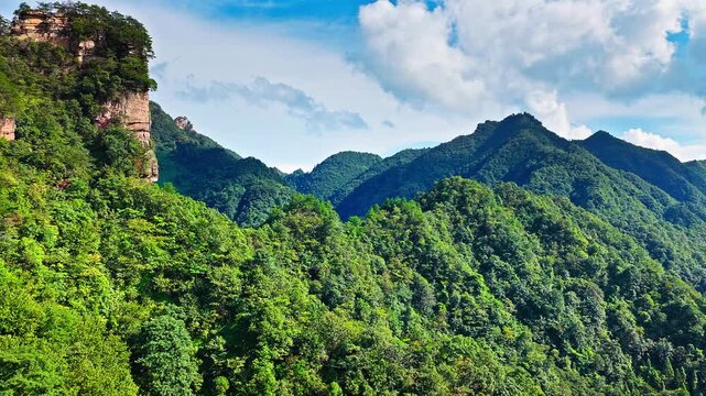 Aerial shot of magnificent sandstone pillars and lush green forest in Zhangjiajie National Forest Park, Hunan Province, China. 