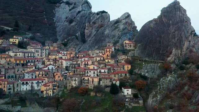 Aerial view of Castelmezzano village nestled among striking Dolomiti Lucane peaks, a captivating blend of architecture and nature, Castelmezzano, Basilicata, Italy.