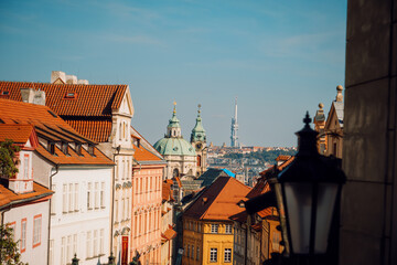 Fototapeta premium Bright Alley Scene, Sunshine Bathes Quiet Street, Evening Glow Highlights Ancient City Roofs