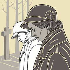 Two women in prayer at a cemetery