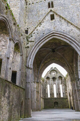 The ruin of Rock of Cashel, showing weathered Gothic stone arches, at Cashel, County Tipperary, Ireland