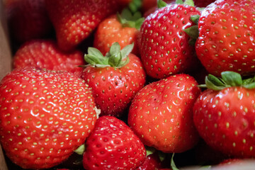Fresh Strawberry Bunch with Vibrant Red Color and Green Leaves