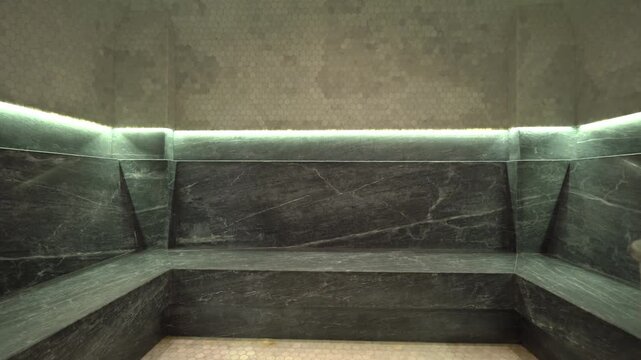 Panoramic Interior of an Empty Traditional Hamam With Heated Marble Benches, Stone Mosaic Tiling, and Soft Ambient Lighting in a Luxury Turkish Steam Bath