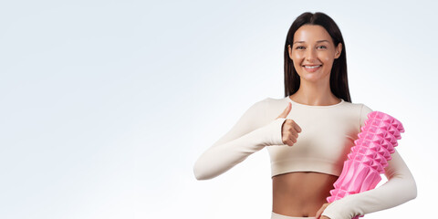 Happy Fit Woman Holding Foam Roller With Thumbs Up And Copy Space