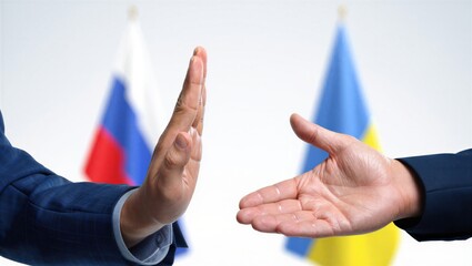 A business person extending a hand for a handshake while another person holds their hand up in a stop gesture. Diplomatic relations concept.