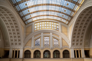 A patina of a historic building interior with a glass dome
