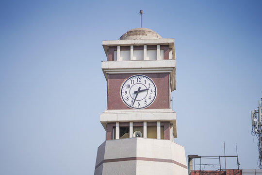 Raipur Chadi Chowk clock tower, Historic clock tower in Raipur city, Chadi Chowk landmark Raipur, Urban clock tower Chhattisgarh, Raipur city heritage structure stock photo.