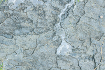 Fototapeta premium Close-up view of granite laid on grass lawn, creating a natural