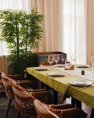 Elegant dining table set for a formal meal with soft natural light