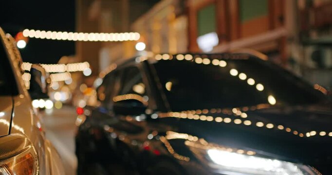 The street at night is not in focus for use as a background.