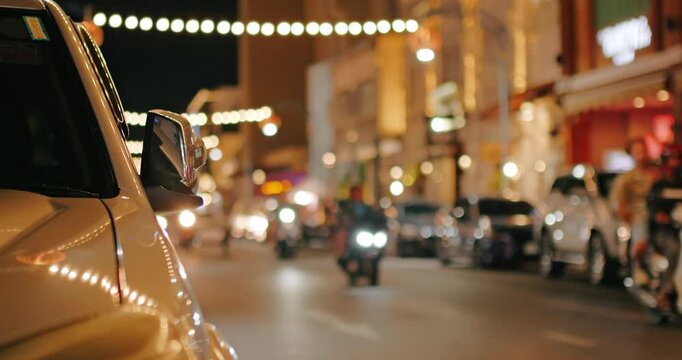 The street at night is not in focus for use as a background.