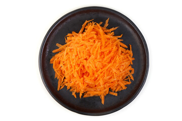 Shredded Carrots on Black Plate, isolated on white background