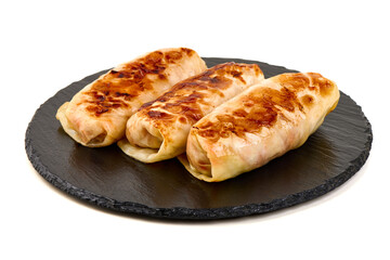 Cabbage Rolls on Black Slate, isolated on white background