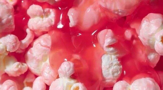 Drizzle strawberry sauce on popcorn, food, popcorn footage.