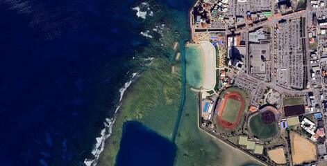 Satellite view of Okinawa island coastline and turquoise ocean