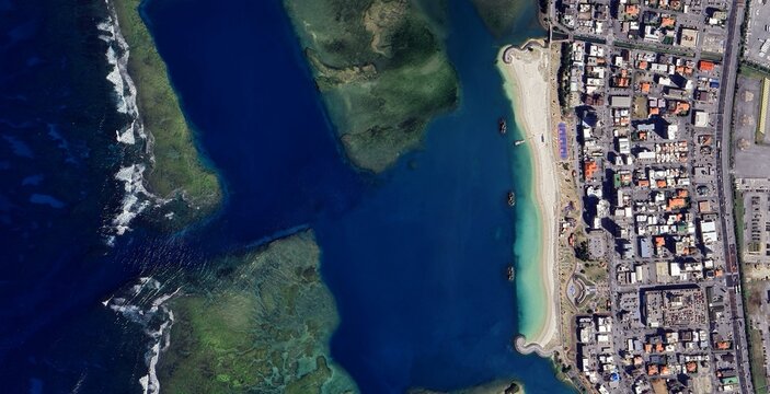 Aerial View of Urban Coastline and Coral Reefs in Okinawa, Japan - Tropical Travel Destination