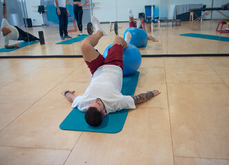 Physical rehabilitation exercises for legs in the gymnasium