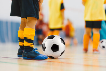 Kids Indoor Soccer Practice. Close-Up of Football Ball Control and Footwork During Youth Training Session