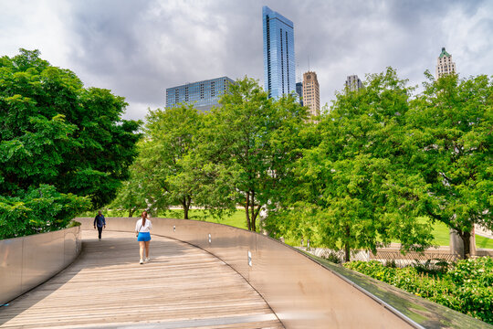 Chicago, IL - July 24, 2024: Tourists and locals in Millennium Park, a major city attraction