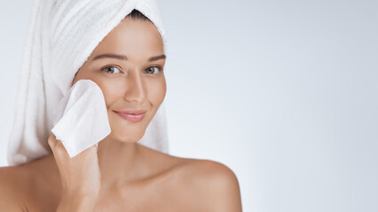 Smiling Woman Drying Face With Soft Towel After Skincare Routine 