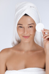 Smiling Woman Holding Cotton Pad for Beauty Skincare Concept 