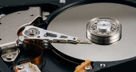 Close up view of the inside of a hard disk drive. HDD data storage mechanism.