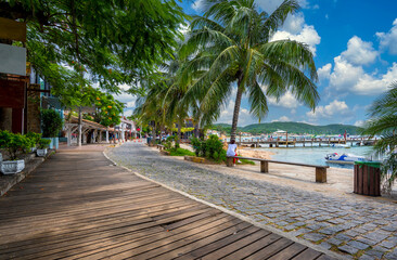 Fototapeta premium Seafront with palms in Buzios, Rio de Janeiro, Brazil. Cityscape of Buzios