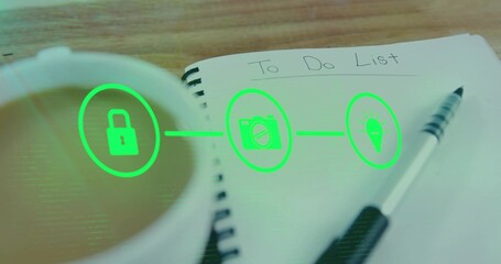 Showing spiral notebook with To Do List, pen resting on wooden tabletop, coffee cup, neon icons