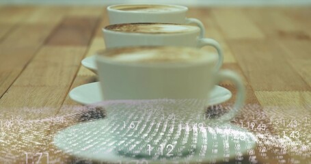 Showing three white coffee cups with saucers receding on cafe table, frothy crema, numeric overlay