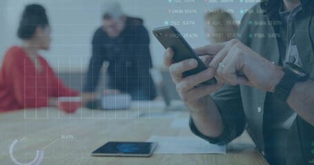 Tapping dark-shirted man checking smartphone at wooden table, with tablet papers charts, copy space