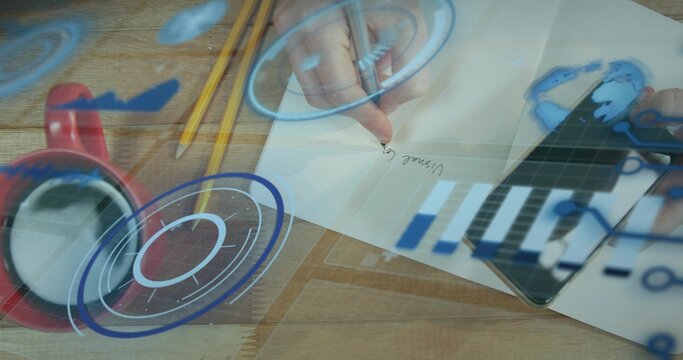 Writing adult hands holding pen tapping tablet at desk light shirt cuff paper pencils mug HUD