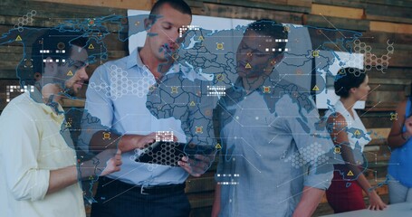 Reviewing trio using tablet while wearing business casual in meeting area with digital map overlay