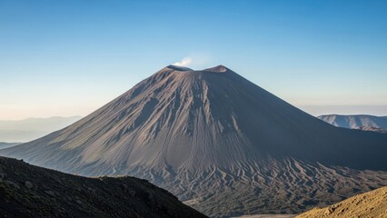 Fototapeta premium Majestic volcano under a clear blue sky landscape photography background