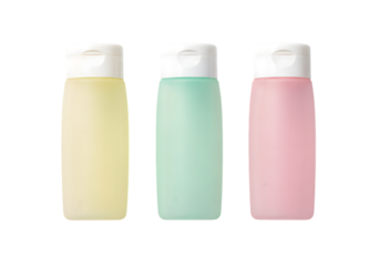 Three colored bottles with white caps isolated on a transparent background 1